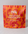 Flow Irresistible Chocolate 2kg pouch standing on a black and white grid surface