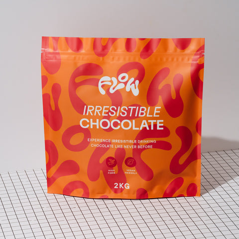 Flow Irresistible Chocolate 2kg pouch standing on a black and white grid surface