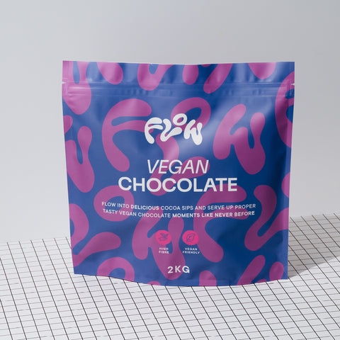 Flow Vegan Chocolate 2kg pouch standing on a black and white grid surface