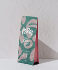 Flow by Blendsmiths Vibrant Chai 1kg pouch at an angle, showing the teal and pink front and pink side gusset