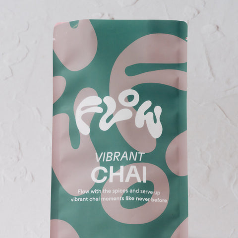 Close-up of the Flow by Blendsmiths Vibrant Chai bag with logo and tagline: Flow with the spices and serve up vibrant chai moments like never before