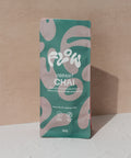 Front view of the Flow by Blendsmiths Vibrant Chai 1kg pouch in teal and pink, reading Pretty Fly for a Spiced Chai, labelled vegan friendly and gluten free