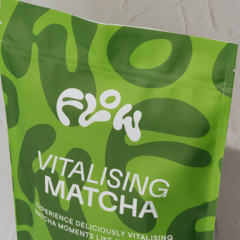 Angled close-up of the top of the Flow Vitalising Matcha pouch, showing the resealable zip
