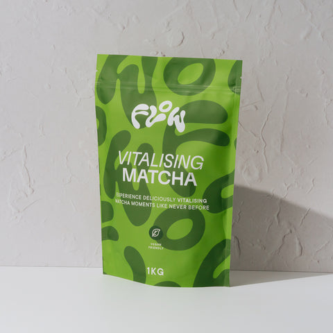 Front view of the Flow by Blendsmiths Vitalising Matcha 1kg pouch in two-tone green, labelled vegan friendly